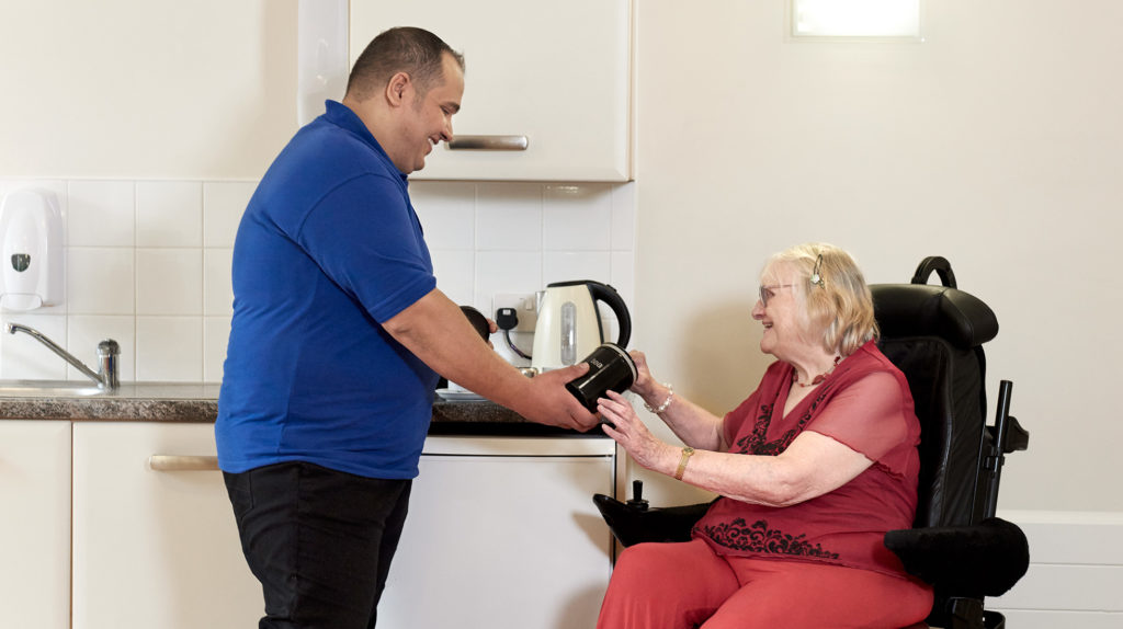 Carer helping a client