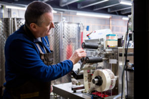 A man using a machine at Exmoor distillery