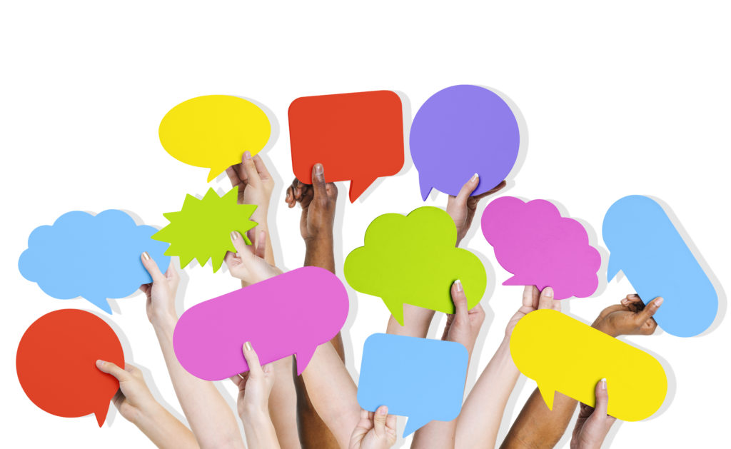 Group of Human Arms Raised with Speech Bubble