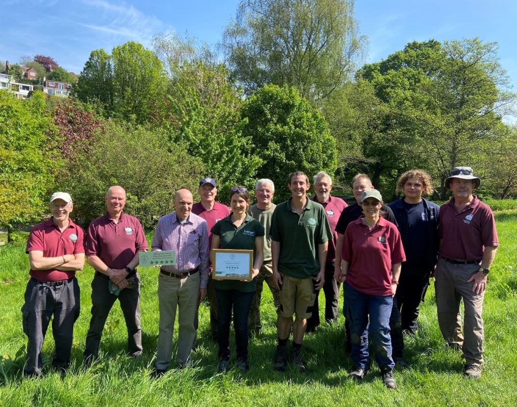 Pictured: Members of the Friends of Yeovil Country Park, volunteers, and Countryside Rangers with their fourth RHS Pride in Parks Award.