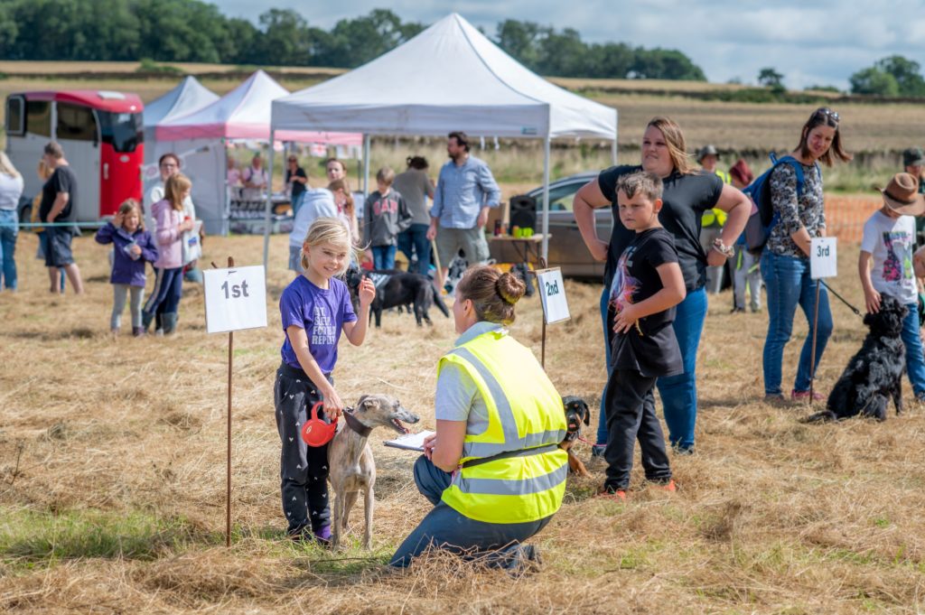 A child and dog receiving first prize at a previous Ham HIll Dog Show