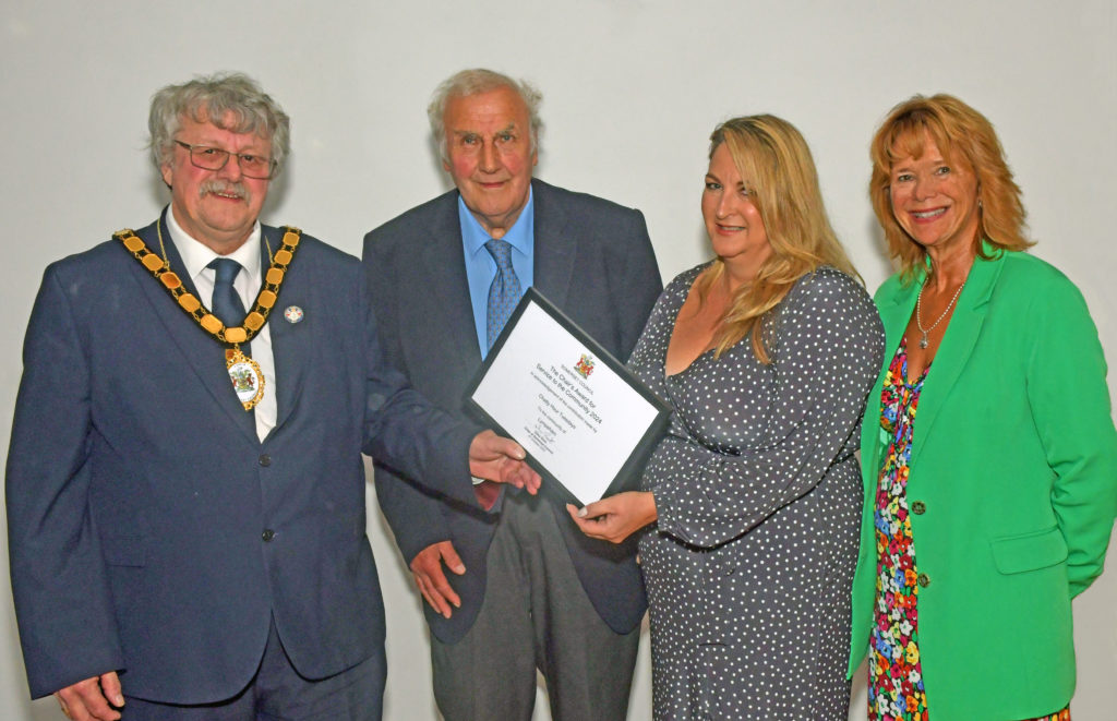 Representatives from Chatty Hour Tuesdays receiving their award from Somerset Council Chair, Cllr Mike Best.