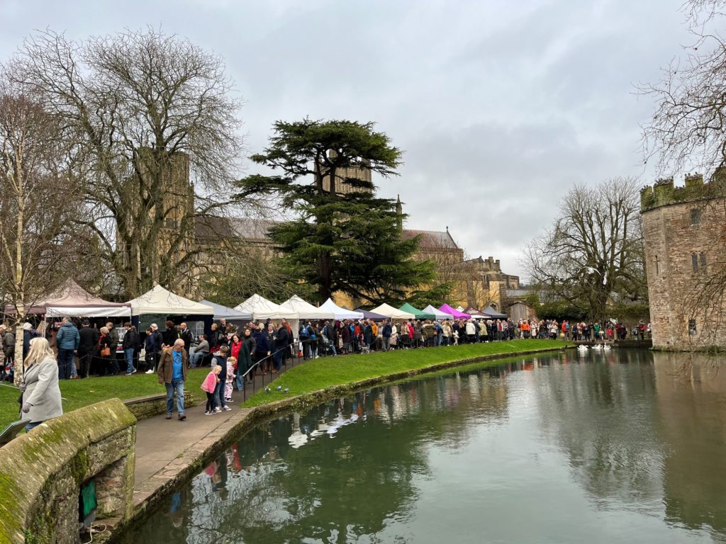 Wells Christmas Market on the Bishop's Palace Green in 2023.