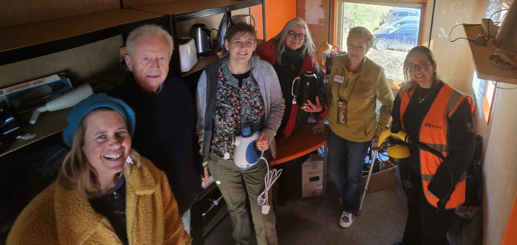 Staff from Glastonbury Re-use Shop, Somerset Community Foundation, CAG Somerset and SUEZ pose for the camera.